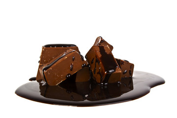 Chocolate candies poured chocolate isolated on white background