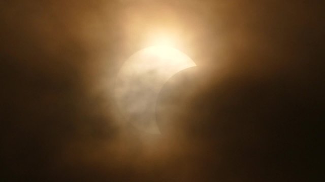 The Moon covering the Sun of partial eclipse, astronomical phenomenon. 