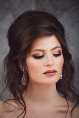 Naklejka premium Studio portrait of beautiful young bride in pink dress
