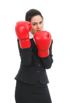 Asian business woman with boxing gloves isolated on white backgr