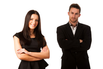 Confident business couple standing one behind the other as a sig