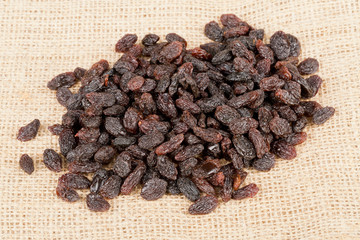 Heap of raisins on burlap