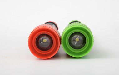 Colorful flashlights on a white background