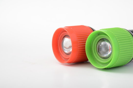 Colorful flashlights on a white background