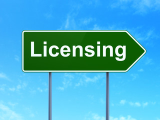 Obraz premium Law concept: Licensing on road sign background