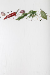 Herbs and spices on white wooden background. Space for text - 104923628