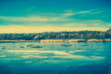 Surface of lake landscape with melting ice, vintage photo