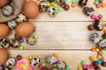 Chocolate and  Easter Eggs Over Wooden Background