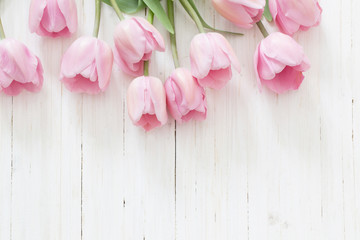 beautiful tulips on wooden background