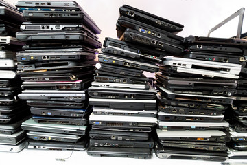 Stack of old, broken and obsolete laptop computer for repair and recycle 

