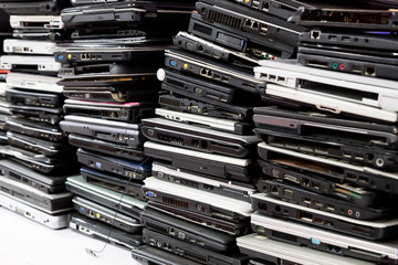 Stack of old, broken and obsolete laptop computer for repair and recycle 
