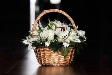 Basket with white flowers.