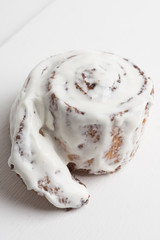Cinnamon rolls on the wooden background