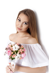 Young cute woman holding Bouquet of flowers