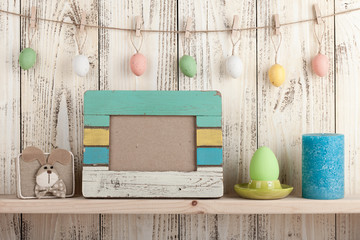 Easter decoration with blank wooden frame