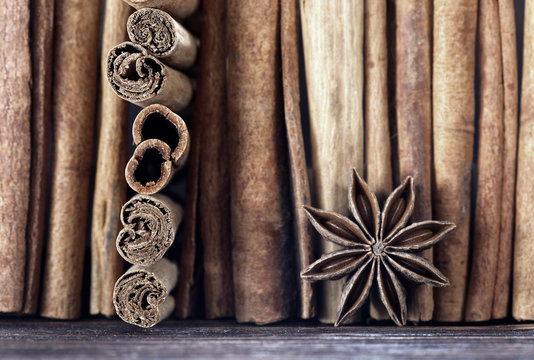 Cinnamon sticks and star anise on a wooden table 