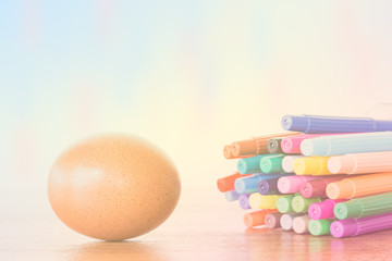 Easter Egg Chickens and color pen on wooden table