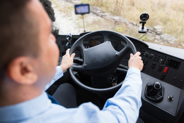 close up of driver driving passenger bus
