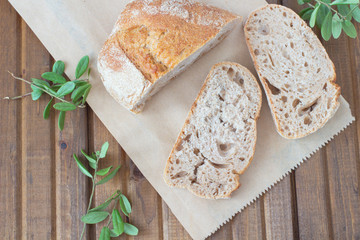 Three slices of bread and green leaves on the table