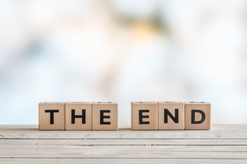 The end sign with wooden blocks