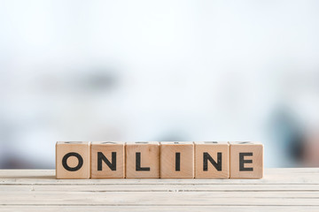 Online sign on a wooden desk