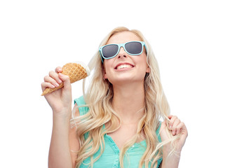 happy young woman in sunglasses eating ice cream