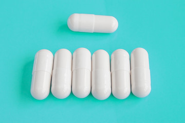 Close up image of white pills.