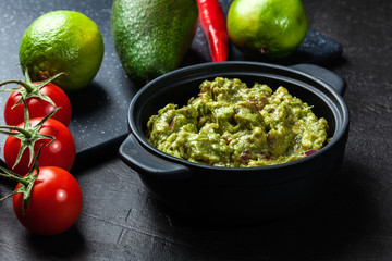 Bowl of guacamole with fresh ingredients