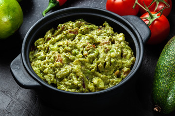 Bowl of guacamole with fresh ingredients