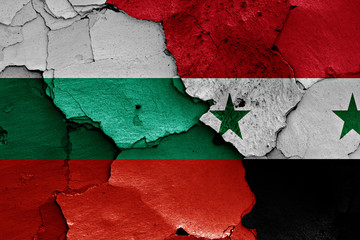flags of Bulgaria and Syria painted on cracked wall