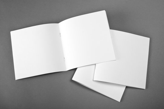 Blank opened magazine isolated on grey background with soft shadow