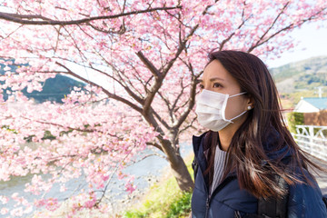 Woman wearing face mask protect from pollen allergy