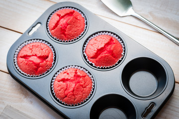 Red velvet cakes on wooden board