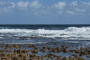 Atlantic ocean coastline by Cape of good hope. Wave splash of rocks.