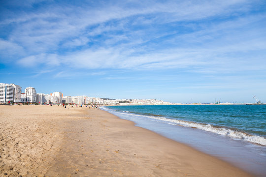 Tangier public beach with walking local people