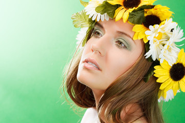 Beautiful woman with flower wreath.