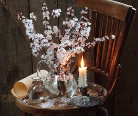 still life with a bouquet of flowering branches of apricot and c