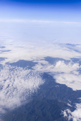 Blue sky with clouds background. view from the window of an airp