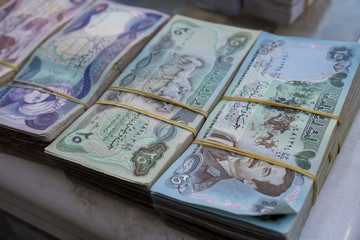 Old Iraqi money with the picture of Saddam Hussein on it used in 1980s in Iraq
