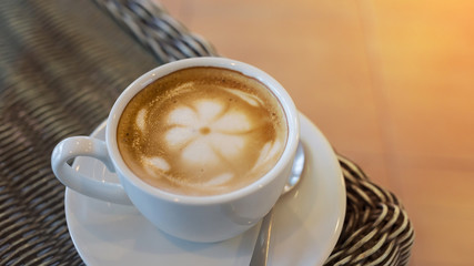 hot latte coffee, white cup on table, latte art coffee