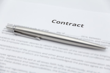 Close up of business contract document with pen.