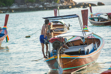 Unidentified villager prepare boat for launch tourist around Lipe island