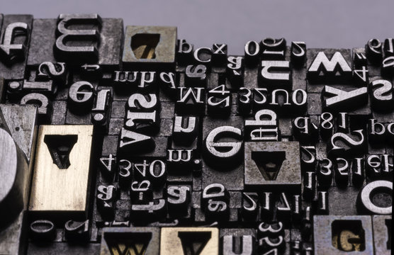 Metal Letterpress Types.
A background from many historic typographical letters in black and white with white background.