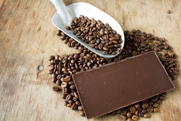 Coffee beans shovel  and chocolate bar