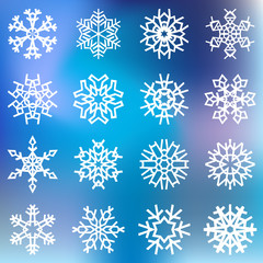Fototapeta na wymiar White snowflakes on blue blurred background