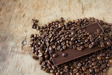 Tiles of dark chocolate and coffee beans 