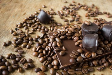 Tiles of dark chocolate candy coffee beans 