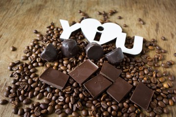Tiles of dark chocolate candy coffee beans 