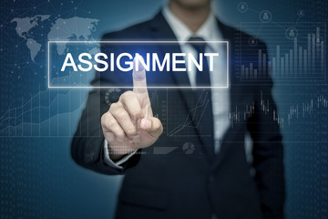 Businessman hand touching ASSIGNMENT  button on virtual screen