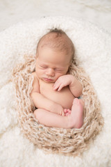 Newborn Baby Sleeping on Blanket